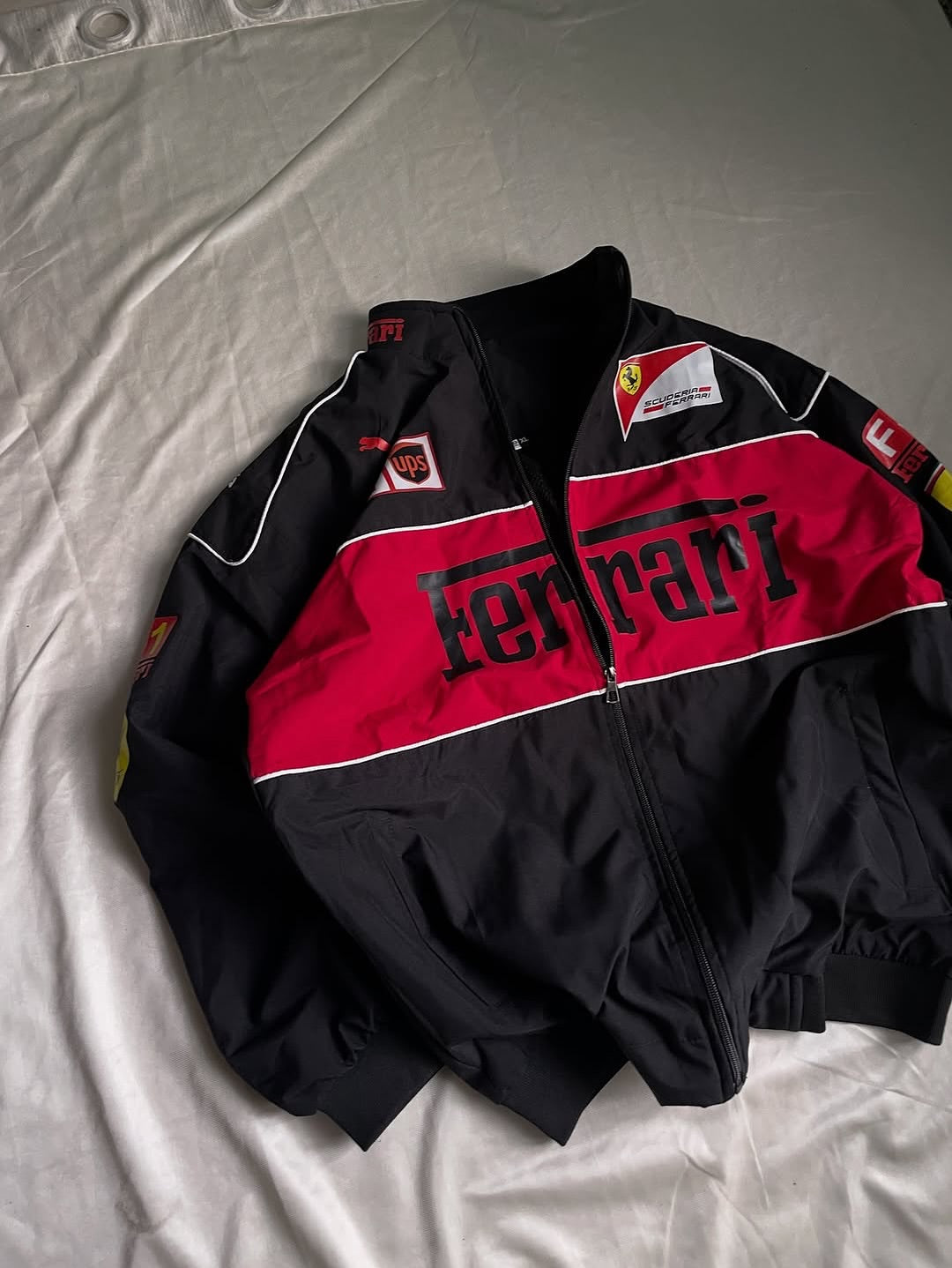 Black and red Ferrari jacket on a light gray background