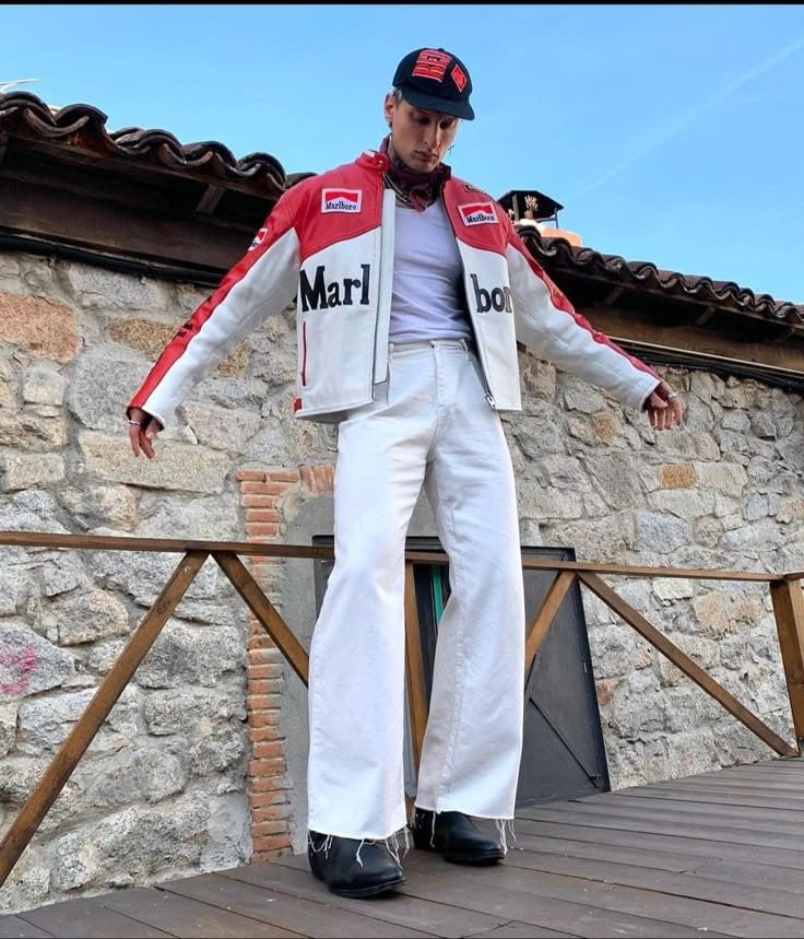 Person wearing a red and white racing suit with 'Marlboro' branding outdoors.