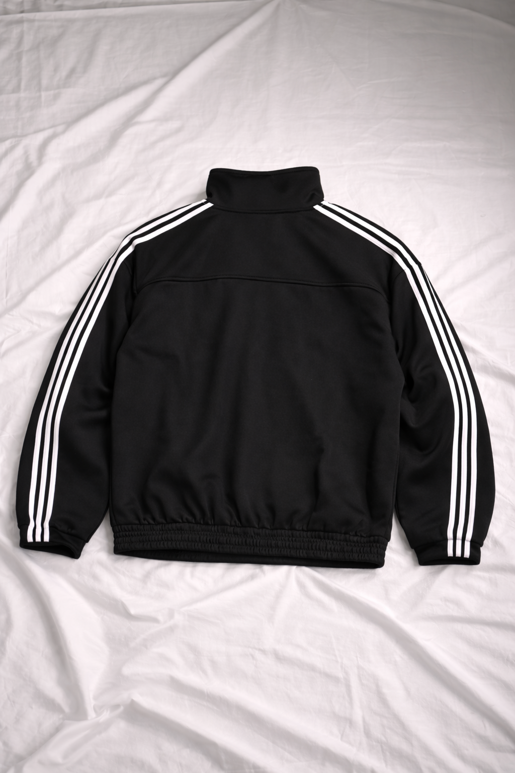 Black jacket with white stripes on a white background